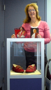 Former Dwyer student stands with papal slippers