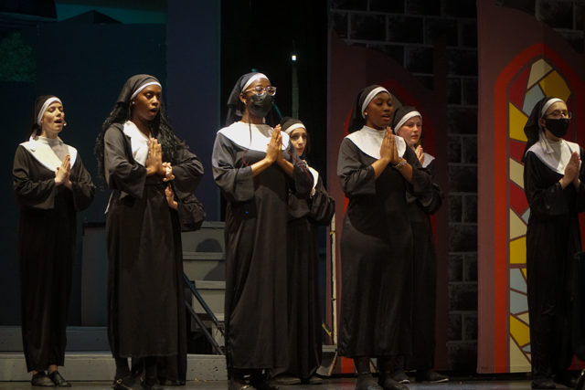 Student nuns praying